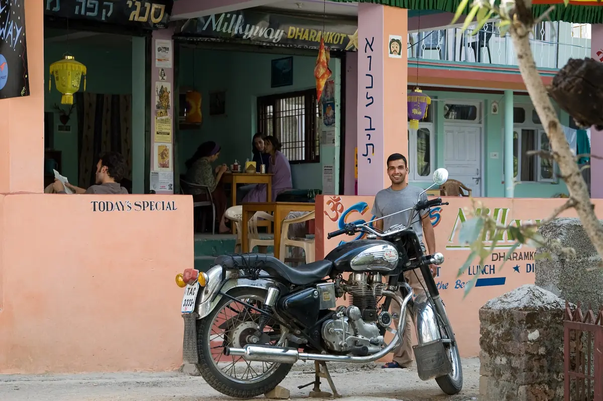 A café with a motorcycle outside in Dharamkot