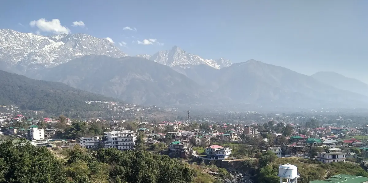 Dharamshala spread out below the snowy mountains