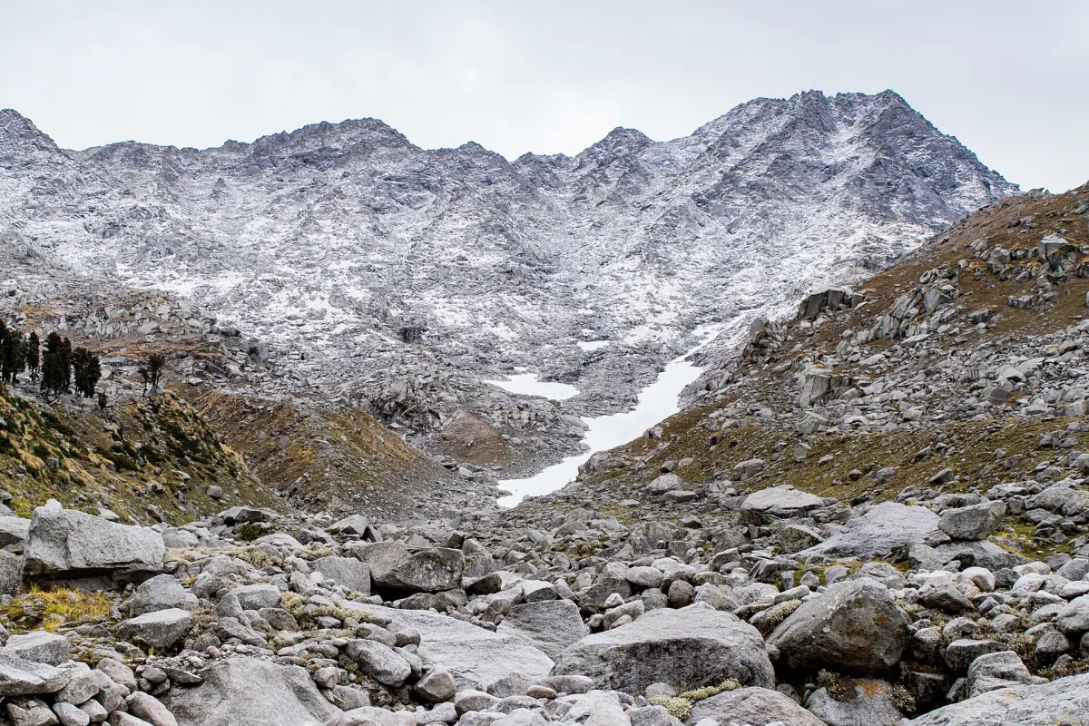 Looking up a rocky valley toward the Indrahar Pass