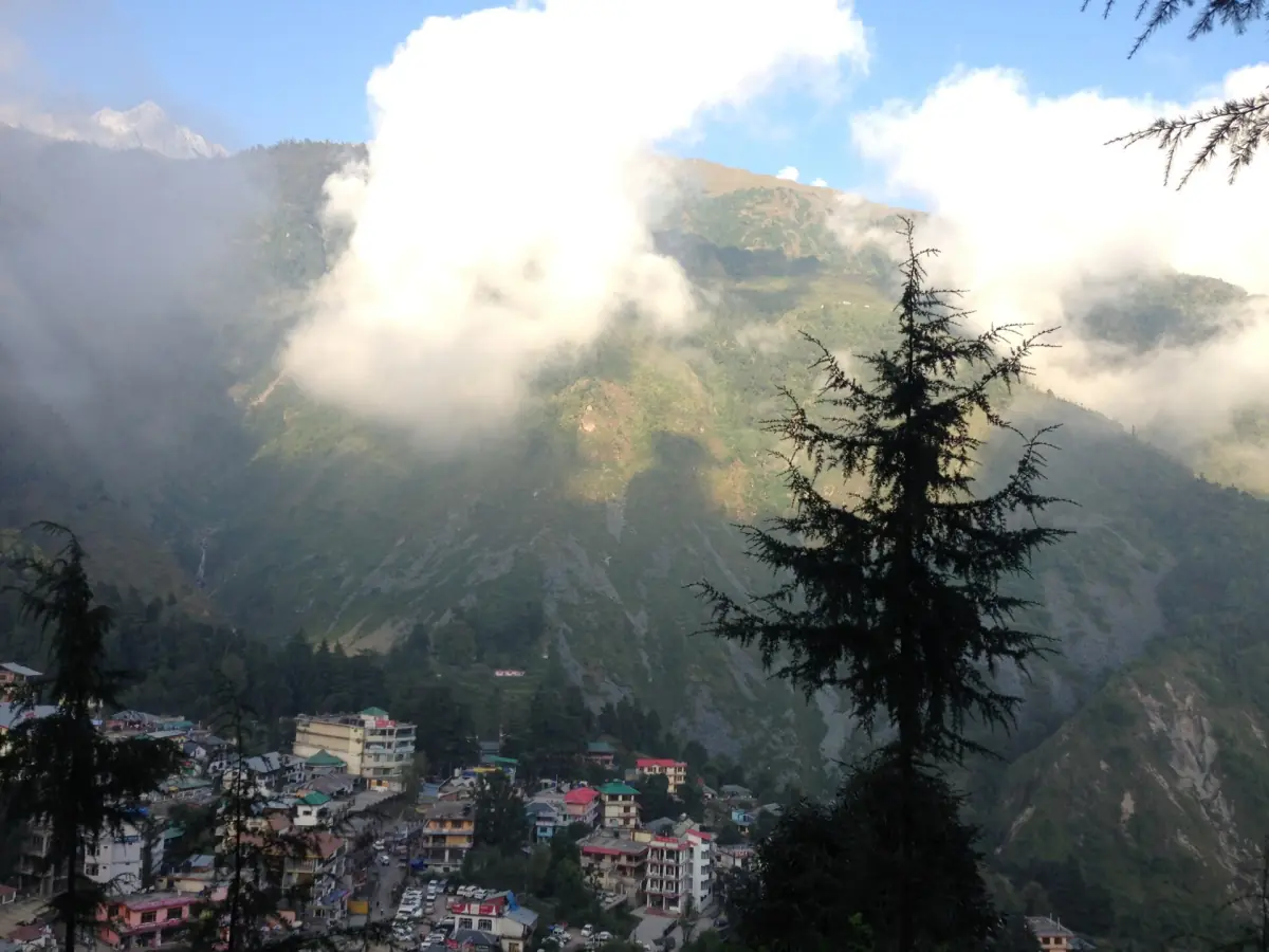 McLeod Ganj on its ridge below the Dhauladhar range in clouds