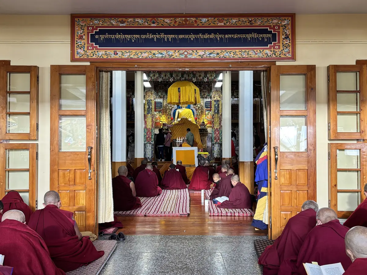 Monks in the prayer hall of Namgyal Monastery