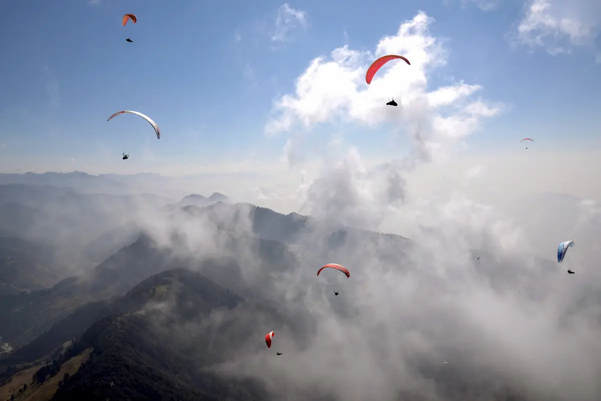 Paragliders in the sky above Bir